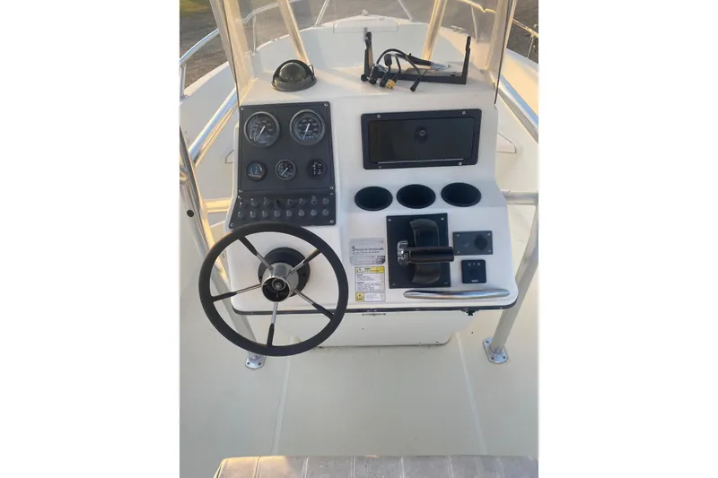 Slide: The Image of 1997 Hydra-Sports 1800 CC boat console with steering wheel and control panel. - 7