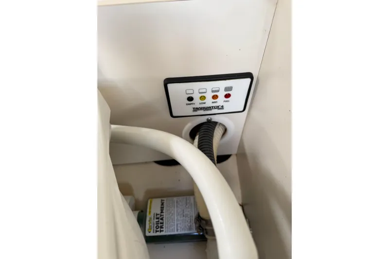 Slide: The Image of Control panel and hose in 2002 Formula 260 Sun Sport boat. - 15