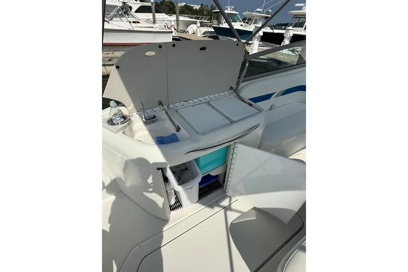 Slide: The Image of 2002 Formula 260 Sun Sport boat interior with open storage and sink area. - 17