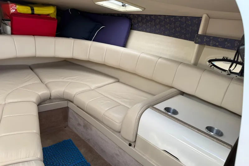 Slide: The Image of Interior of 2002 Formula 260 Sun Sport boat with beige seating and storage. - 20