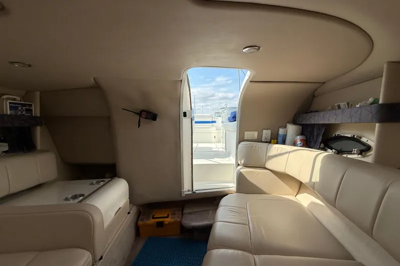 Slide: The Image of Interior of 2002 Formula 260 Sun Sport boat with beige seating and open deck view. - 22