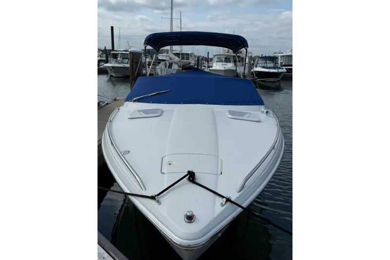 Slide: The Image of 2002 Formula 260 Sun Sport boat docked with blue cover and canopy. - 4