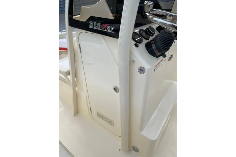 Slide: The Image of 2026 Scout 215 XSF boat console with steering wheel and control panel. - 11