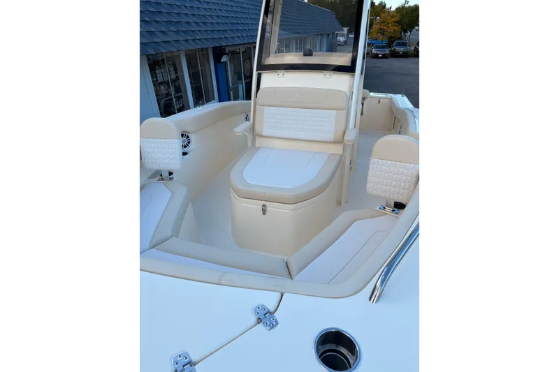 Slide: The Image of 2026 Scout 215 XSF boat interior with cushioned seating and modern design. - 19