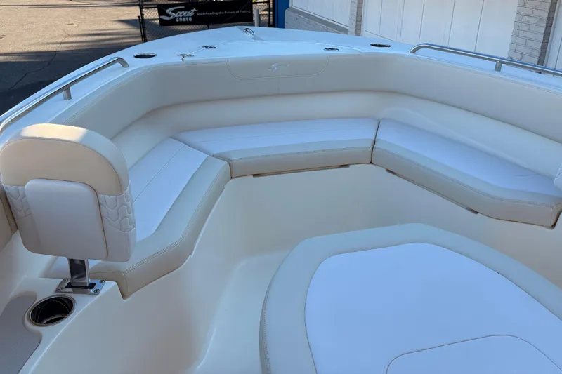 Slide: The Image of 2026 Scout 215 XSF boat interior with white cushioned seating. - 4