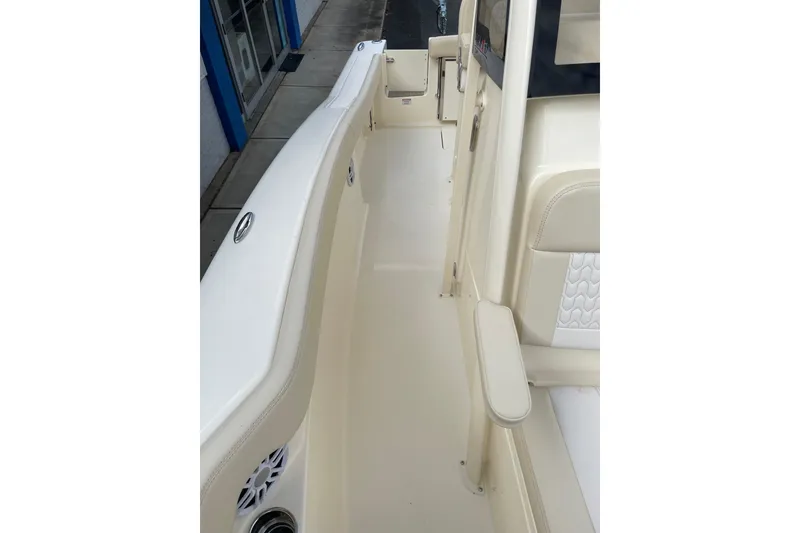 Slide: The Image of 2026 Scout 215 XSF boat interior, featuring sleek white seating and modern design elements. - 9
