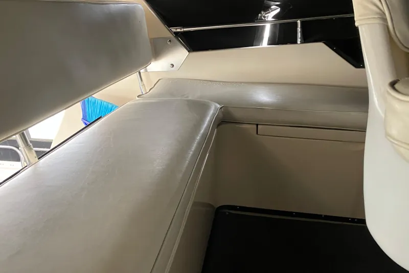 Slide: The Image of 1987 President 37 Sundeck interior seating area with beige upholstery. - 17