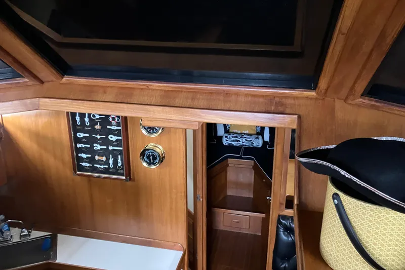 Slide: The Image of Interior of 1987 President 37 Sundeck yacht with wooden paneling and nautical decor. - 28