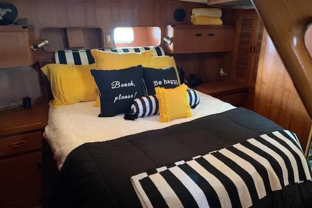 Slide: The Image of Cozy bedroom in 1987 President 37 Sundeck yacht with nautical-themed decor. - 45
