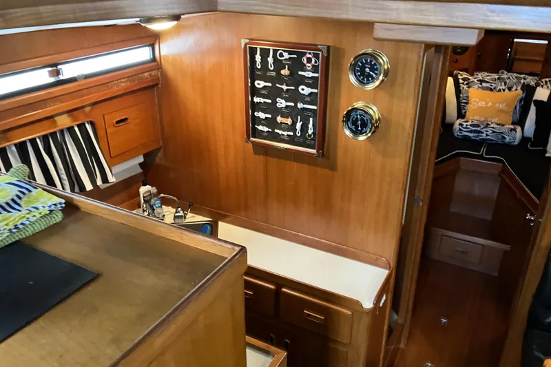 Slide: The Image of Interior of 1987 President 37 Sundeck yacht with wood paneling and nautical decor. - 54