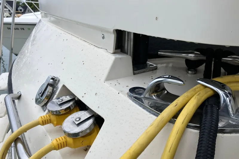 Slide: The Image of 1987 President 37 Sundeck boat with yellow power cables and chrome fittings. - 7