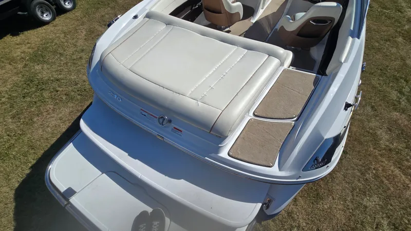 Slide: The Image of 2013 Cobalt 210 boat with beige seating and swim platform, viewed from above. - 7