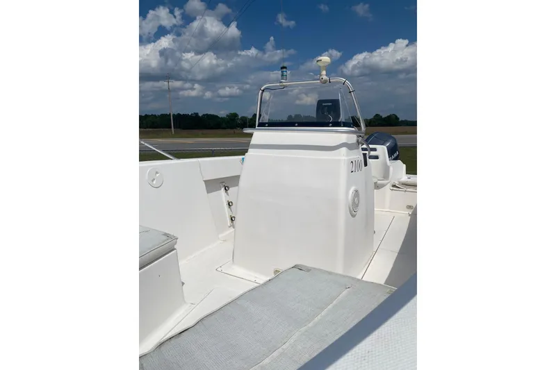 Slide: The Image of 2001 Angler 2100 Center Console boat with clear skies and open deck. - 8
