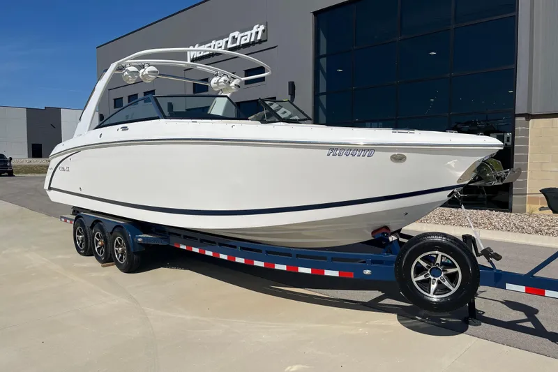 Slide: The Image of 2021 Cobalt R30 boat on trailer outside MasterCraft building. - 1