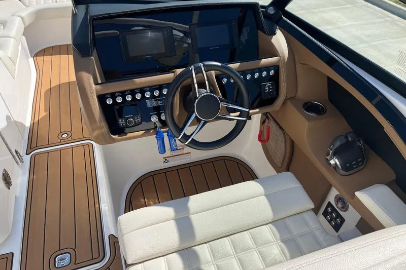 Slide: The Image of 2021 Cobalt R30 boat cockpit with modern controls and luxurious seating. - 10