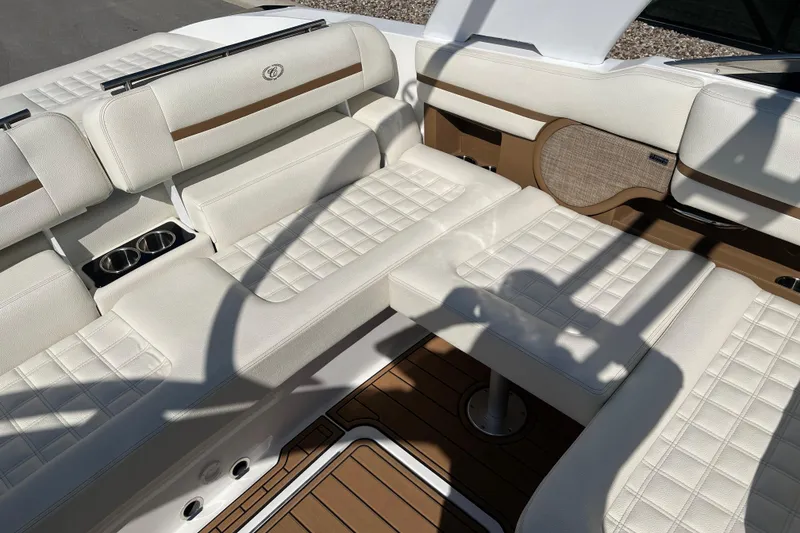 Slide: The Image of Luxurious interior of 2021 Cobalt R30 boat with white leather seating and cup holders. - 15