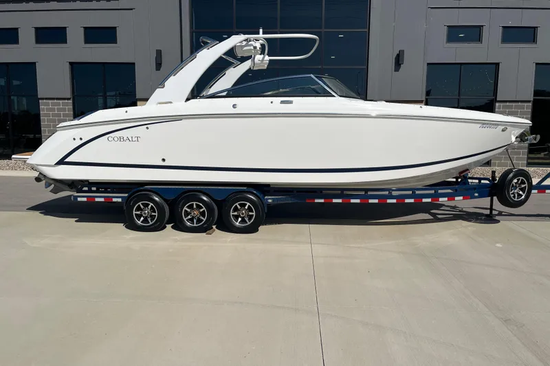 Slide: The Image of 2021 Cobalt R30 boat on trailer, parked outside modern building. - 3
