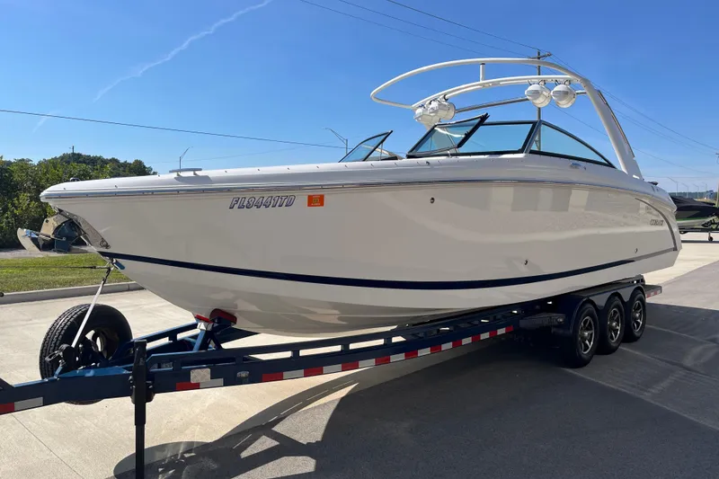 Slide: The Image of 2021 Cobalt R30 boat on trailer, sleek design, sunny day, parked outdoors. - 5
