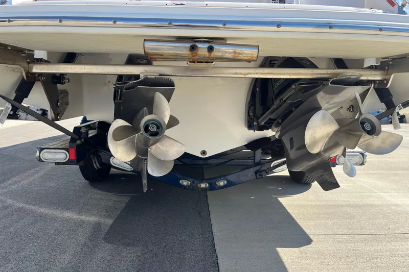 Slide: The Image of Rear view of a 2021 Cobalt R30 boat showing dual propellers and outboard motors. - 7