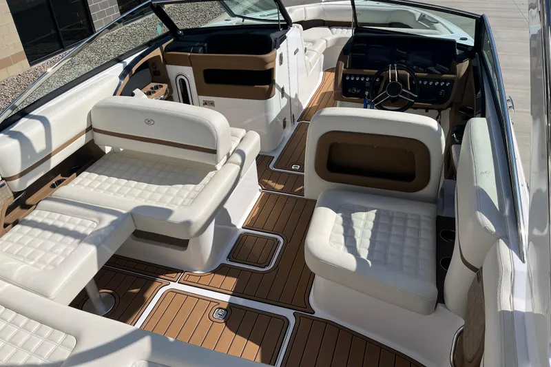 Slide: The Image of Luxurious interior of 2021 Cobalt R30 boat with white seating and wood accents. - 9