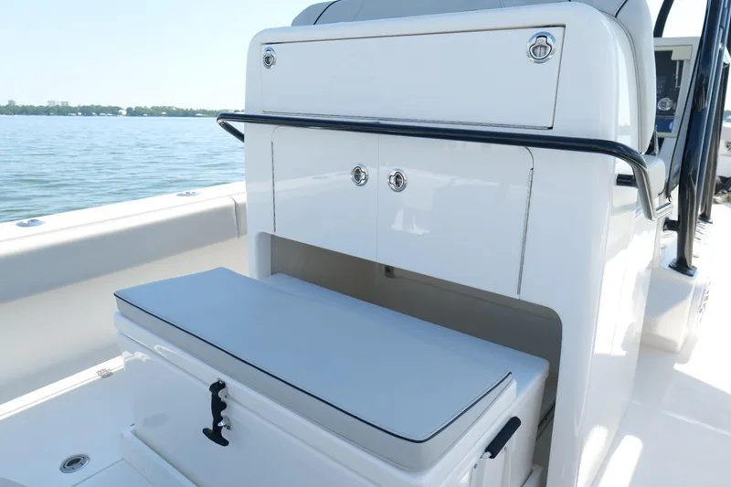 Slide: The Image of 2023 SeaVee 32 boat interior with storage compartments and cushioned seating. - 15