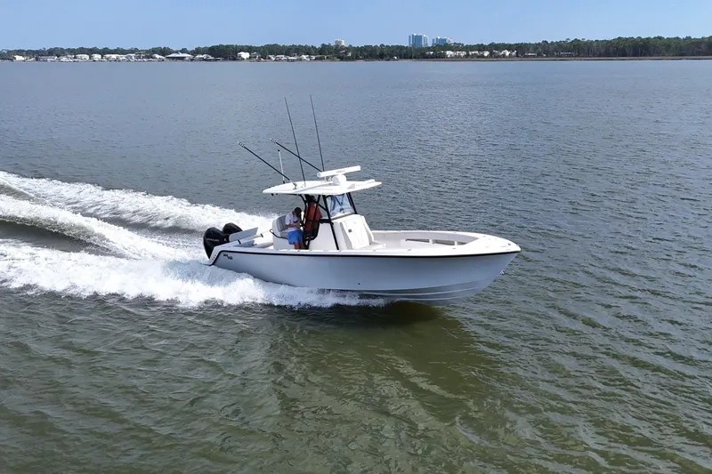 Slide: The Image of 2023 SeaVee 32 boat cruising on open water, showcasing sleek design and performance. - 53