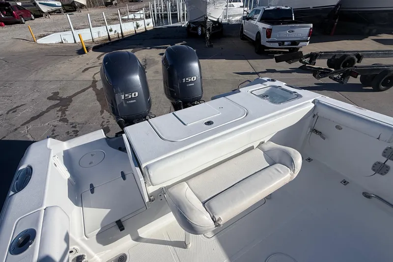 Slide: The Image of 2015 Sea Hunt Gamefish 25 boat with twin Yamaha 150 engines at a marina. - 10