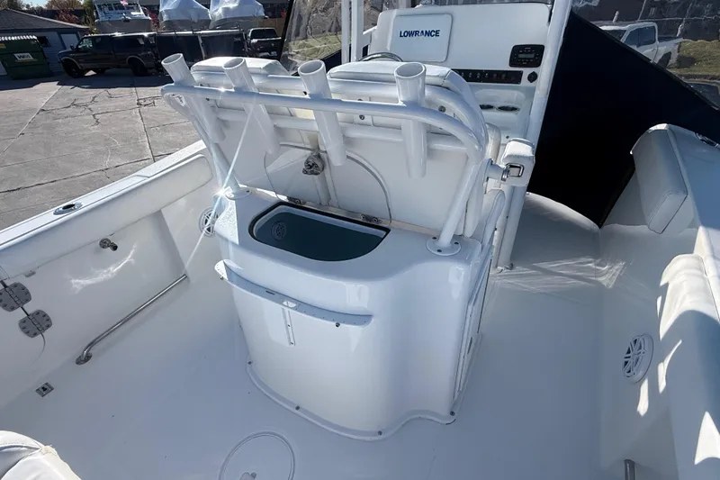 Slide: The Image of 2015 Sea Hunt Gamefish 25 boat interior with rod holders and Lowrance electronics. - 11