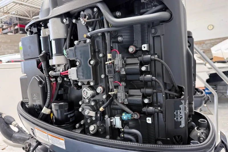 Slide: The Image of Close-up of a 2015 Sea Hunt Gamefish 25 boat engine components. - 25