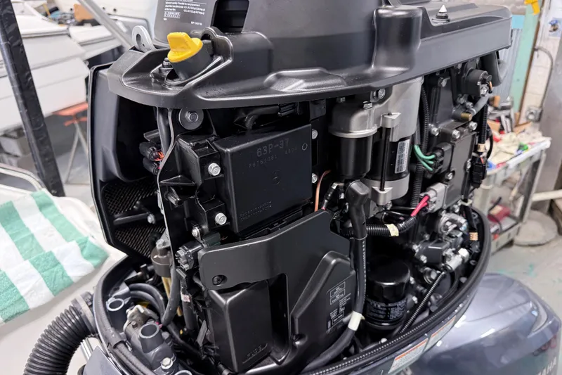 Slide: The Image of Close-up of a 2015 Sea Hunt Gamefish 25 outboard motor, showcasing internal components. - 28