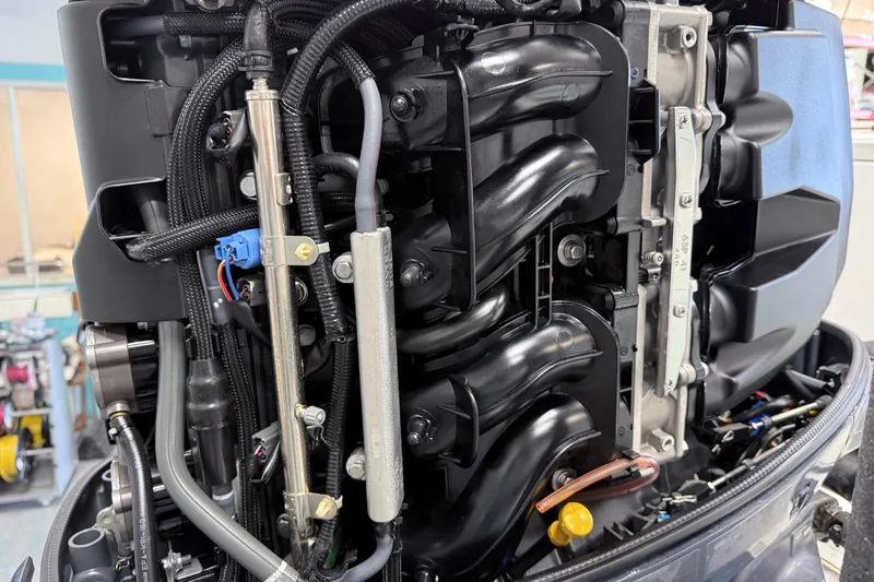 Slide: The Image of Close-up of a 2015 Sea Hunt Gamefish 25 engine components and wiring. - 32