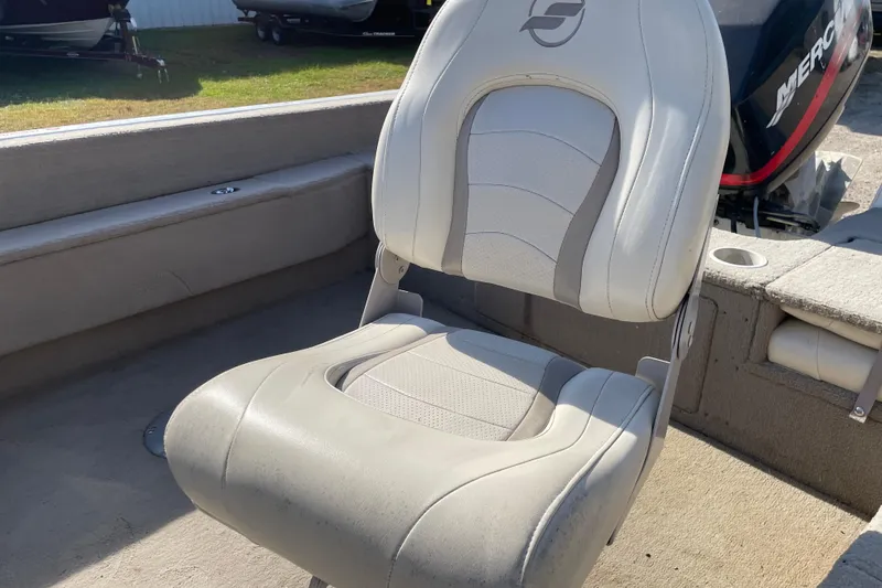 Slide: The Image of 2004 Starcraft C-Star 1800 OB boat interior with open storage compartment and seating. - 12