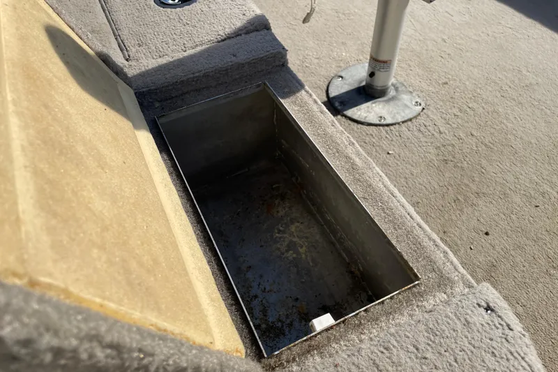 Slide: The Image of 2004 Starcraft C-Star 1800 OB boat seat with Mercury engine in background. - 14