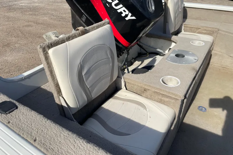 Slide: The Image of 2004 Starcraft C-Star 1800 OB boat interior with seating and storage compartment. - 16