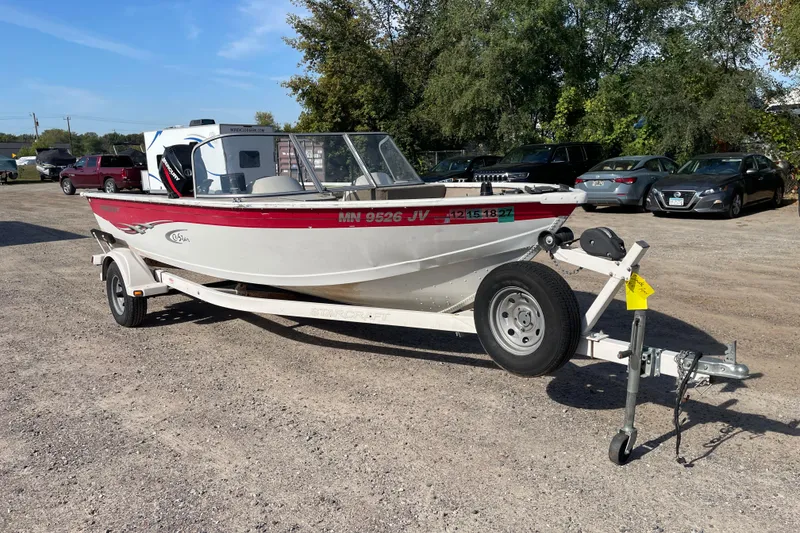 Slide: The Image of 2004 Starcraft C-Star 1800 OB boat with Mercury outboard motor on a trailer. - 2