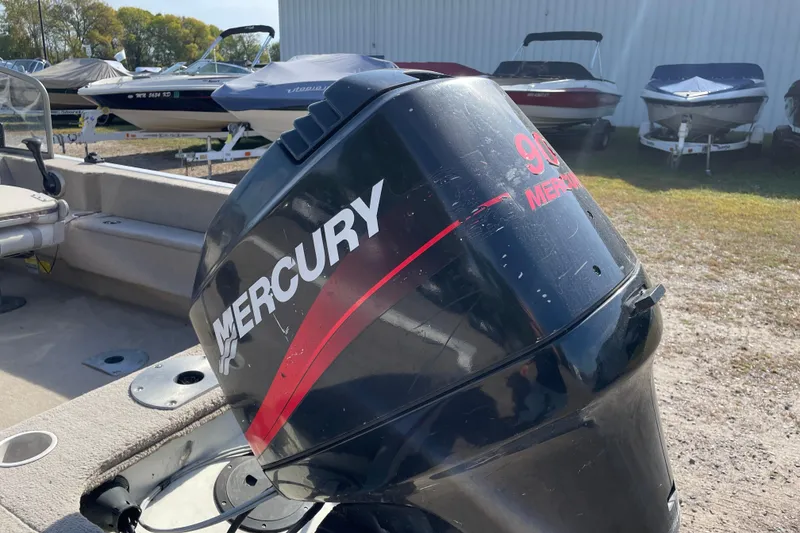 Slide: The Image of 2004 Starcraft C-Star 1800 OB boat interior with seating and steering console. - 5