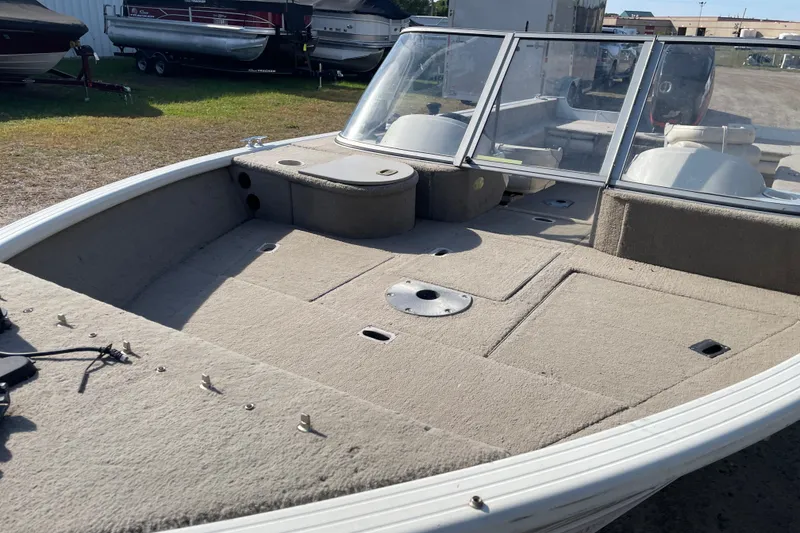 Slide: The Image of 2004 Starcraft C-Star 1800 OB boat interior with Mercury outboard motor. - 8