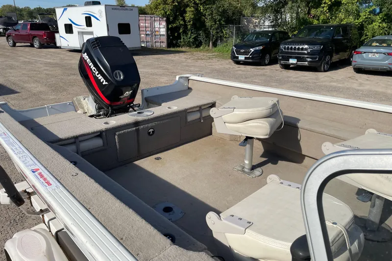 Slide: The Image of 2004 Starcraft C-Star 1800 OB boat dashboard with steering wheel and navigation system. - 9