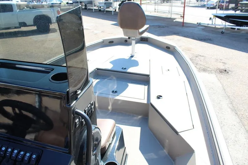 Slide: The Image of 2026 Excel Bay Pro Elite 230 boat interior with steering console and seating. - 10