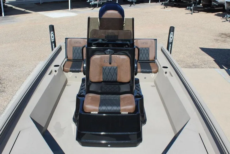 Slide: The Image of 2026 Excel Bay Pro Elite 230 boat interior with brown and black seating. - 14