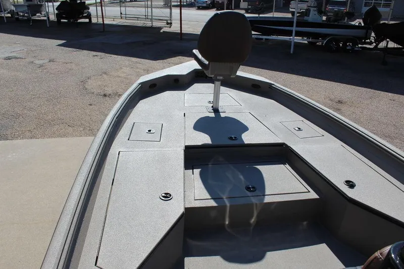 Slide: The Image of 2026 Excel Bay Pro Elite 230 boat deck with seating and storage compartments. - 17