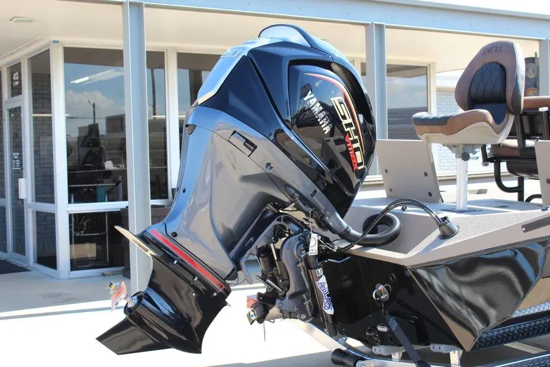 Slide: The Image of 2026 Excel Bay Pro Elite 230 with Yamaha outboard motor, displayed outdoors. - 3
