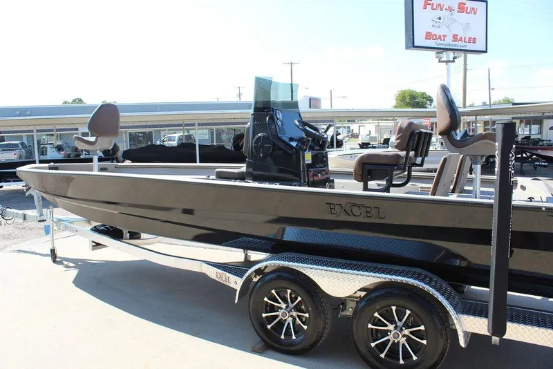 Slide: The Image of 2026 Excel Bay Pro Elite 230 boat on trailer at dealership. - 4