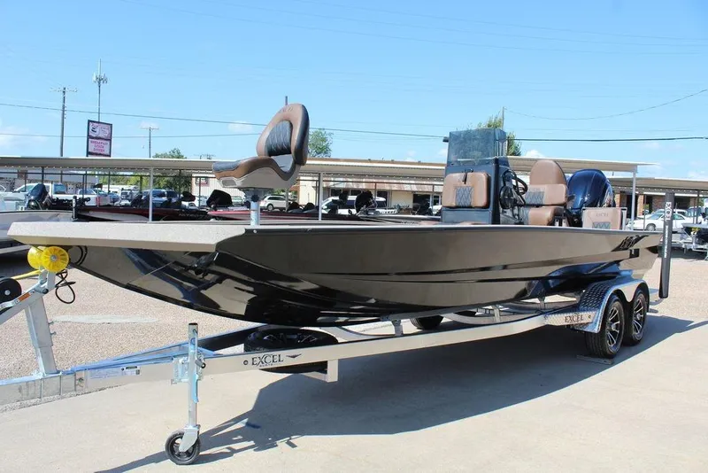 Slide: The Image of 2026 Excel Bay Pro Elite 230 boat on trailer, featuring sleek design and comfortable seating. - 5