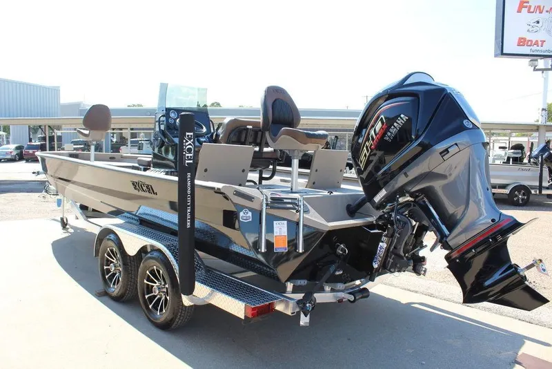 Slide: The Image of 2026 Excel Bay Pro Elite 230 boat with Yamaha outboard motor on trailer. - 7