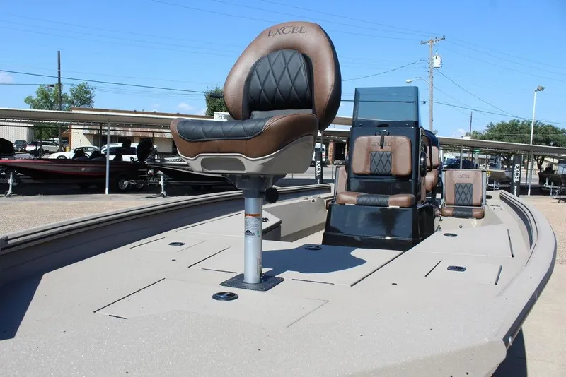 Slide: The Image of 2026 Excel Bay Pro Elite 230 boat with leather seating, displayed outdoors. - 8