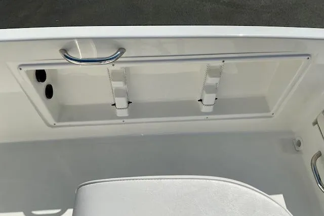 Slide: The Image of Bayliner Trophy T18 2026 boat interior detail with storage compartment and handle. - 10