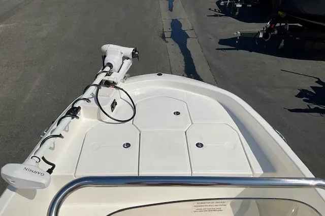 Slide: The Image of 2026 Bayliner Trophy T18 boat deck with Garmin equipment, docked on pavement. - 13