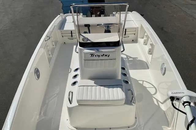 Slide: The Image of 2026 Bayliner Trophy T18 boat interior with seating and steering console. - 15
