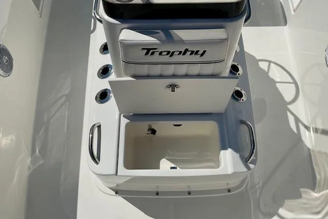 Slide: The Image of 2026 Bayliner Trophy T18 boat interior with storage compartment and seating. - 16